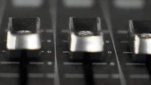 Channel faders on a mixing console, close up