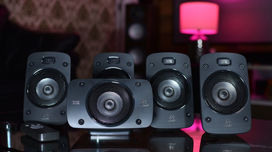 Close up of black speaker cabinets in a dimly lit room