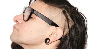 Skrillex Looking Aside While Making Dubstep Music